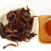Organic Yunnan Gold Tea Leaves and cup of tea