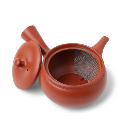 Red ceramic teapot with a lid on a white background