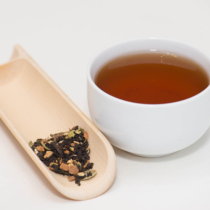 Organic Masala Chai tea cup and tea leaves